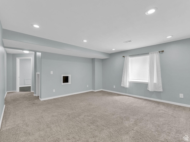 unfurnished room featuring carpet, recessed lighting, and baseboards