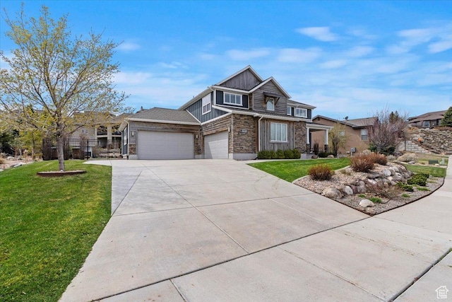 view of front of property with an attached garage, stone siding, concrete driveway, and board and batten siding