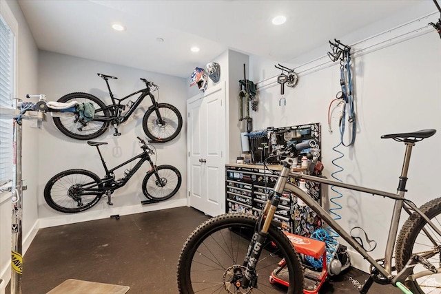 garage with baseboards and recessed lighting
