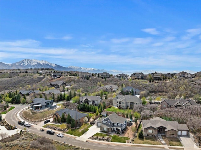 aerial view of residential area featuring mountains