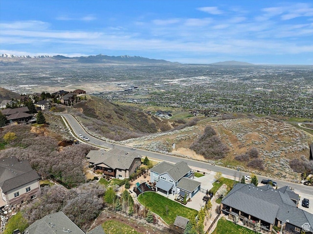 view of property location with nearby suburban area and mountains