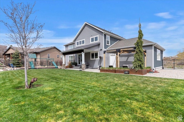 back of property with a playground, a patio area, stucco siding, and a gazebo