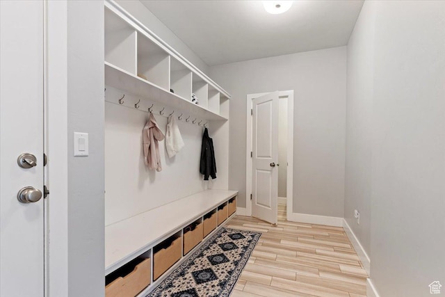 mudroom with light wood-type flooring and baseboards