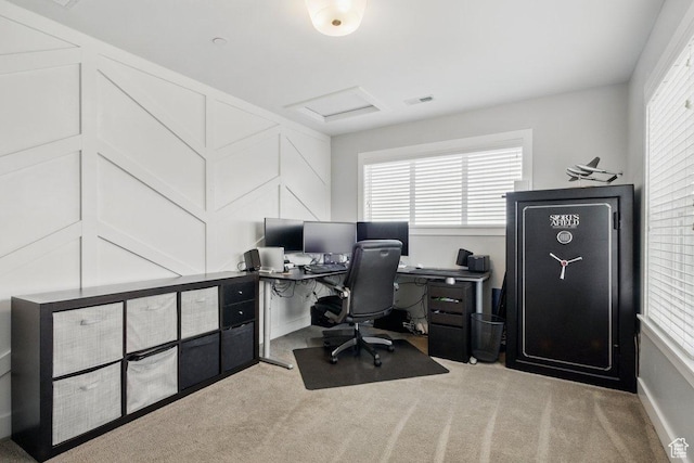 office area with carpet flooring, healthy amount of natural light, and attic access