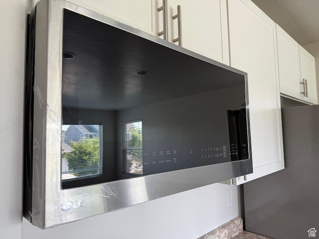 3678 W Sunrise Sky Ln S, South Jordan, UT 84009 - kitchen view of stainless steel microwave and white cabinetry
