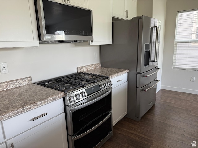 3678 W Sunrise Sky Ln S, South Jordan, UT 84009 - kitchen featuring stainless steel appliances, dark wood finished floors, light countertops, and white cabinetry