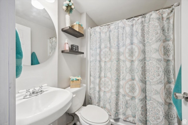bathroom featuring toilet and a sink