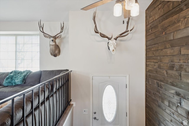 foyer entrance with ceiling fan
