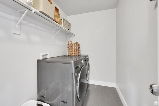 2385 E 430 S, Spanish Fork, UT 84660 - laundry room featuring baseboards, dark tile patterned floors, washer and clothes dryer, and laundry area