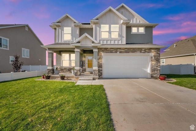 craftsman inspired home featuring fence, stone siding, board and batten siding, and driveway