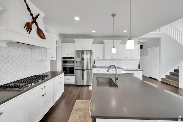2385 E 430 S, Spanish Fork, UT 84660 - kitchen featuring dark countertops, tasteful backsplash, a sink, stainless steel appliances, and dark wood-type flooring