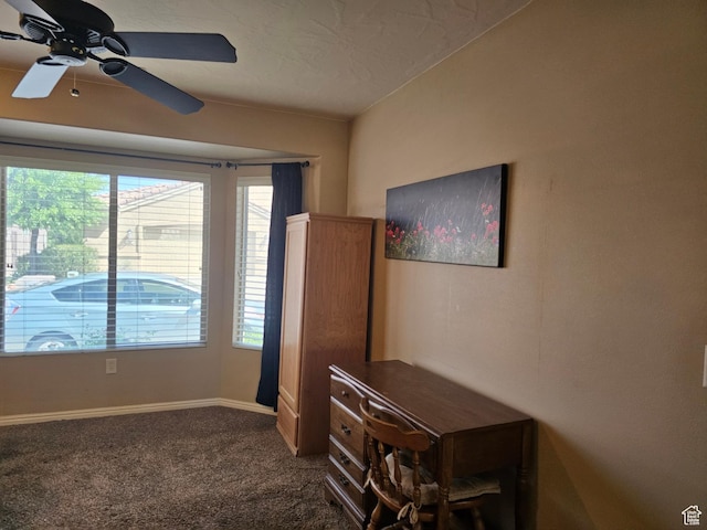 unfurnished room featuring plenty of natural light, a ceiling fan, baseboards, and carpet floors