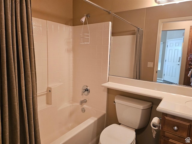 bathroom featuring toilet, vanity, and shower / tub combo with curtain