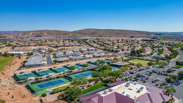 birds eye view of property with a mountain view