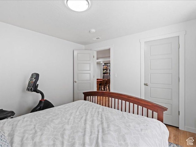 bedroom featuring light wood finished floors
