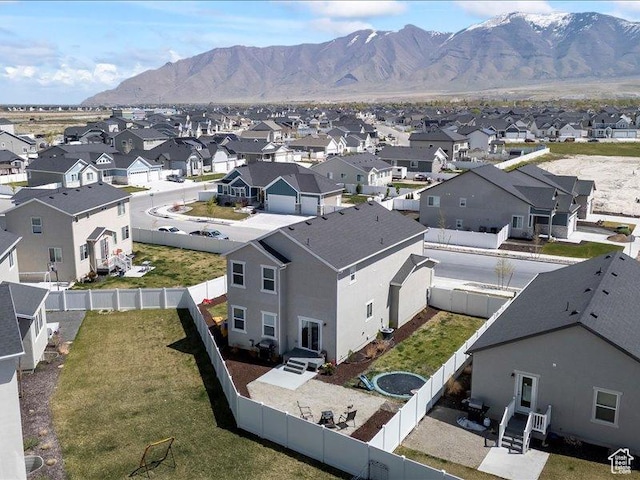 drone / aerial view featuring a residential view and a mountain view