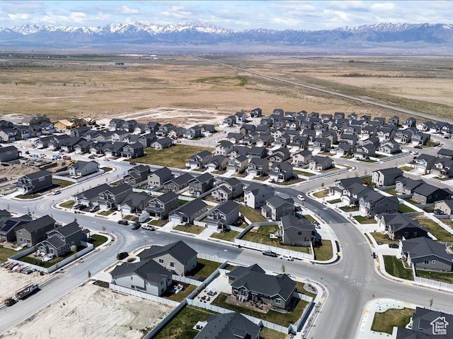 drone / aerial view with a residential view and a mountain view