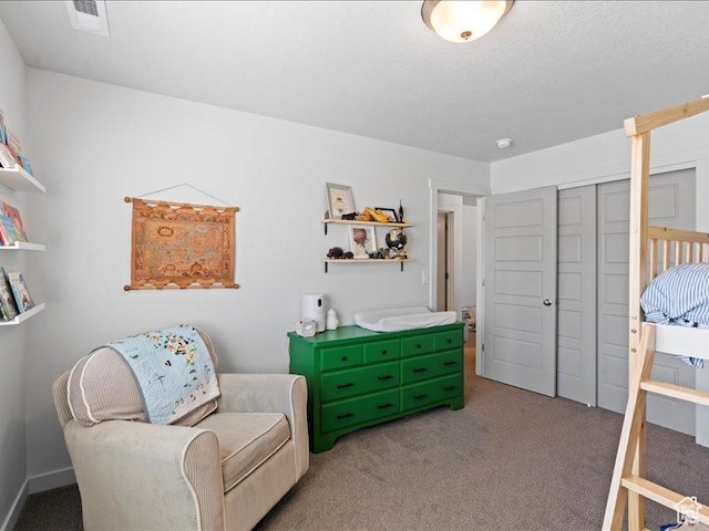 sitting room featuring carpet and visible vents