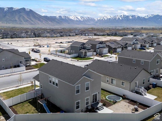 drone / aerial view featuring a mountain view and a residential view