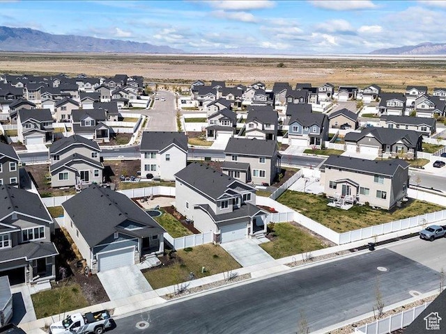 birds eye view of property with a residential view and a mountain view