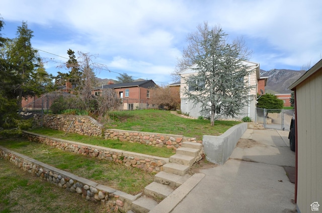 view of yard featuring a gate and fence