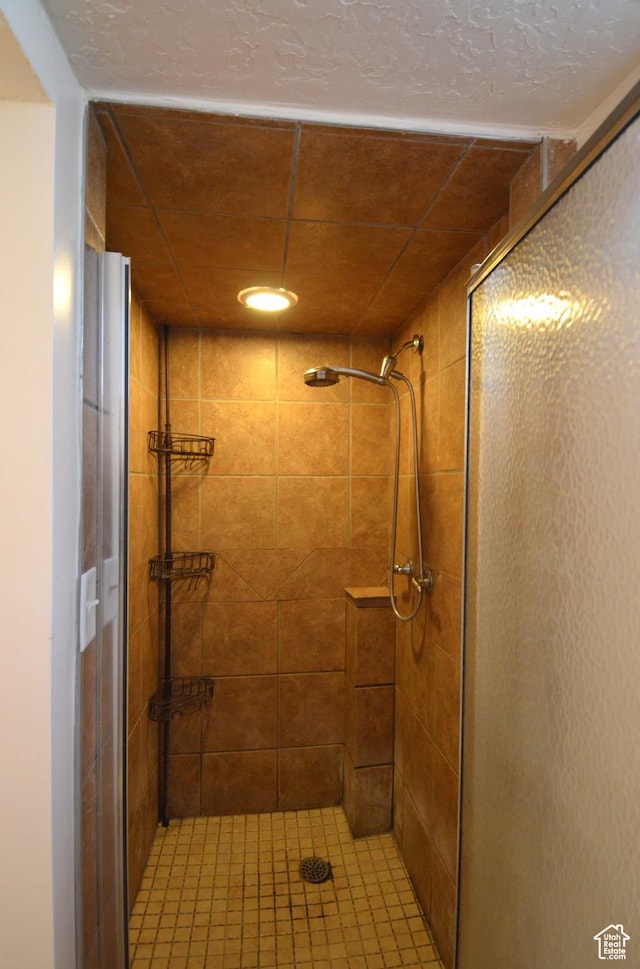 bathroom featuring a stall shower