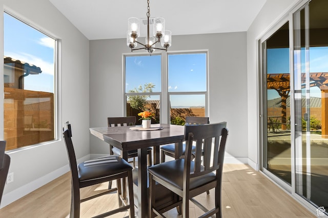 315 W Camino Borde, Washington, UT 84780 - dining area featuring baseboards, a chandelier, and light wood-style flooring