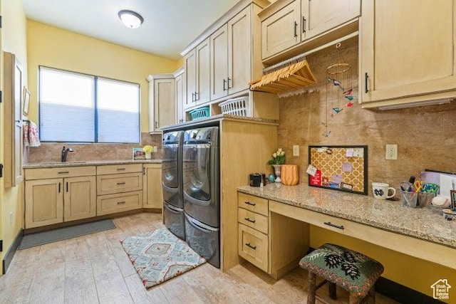 3052 N Snow Canyon Pkwy Unit 67, St George, UT 84770 - laundry area with cabinet space, a sink, light wood finished floors, and independent washer and dryer