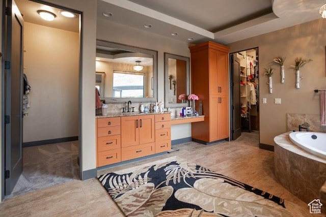 3052 N Snow Canyon Pkwy Unit 67, St George, UT 84770 - full bath with a spacious closet, baseboards, a garden tub, and vanity