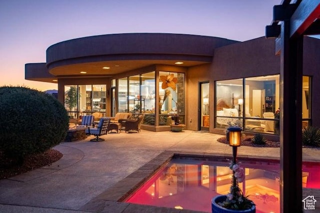 3052 N Snow Canyon Pkwy Unit 67, St George, UT 84770 - rear view of house with a patio area, an outdoor hangout area, and an outdoor pool
