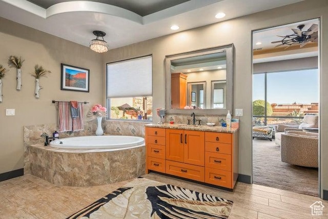 3052 N Snow Canyon Pkwy Unit 67, St George, UT 84770 - full bathroom with a bath, wood finished floors, vanity, and a healthy amount of sunlight