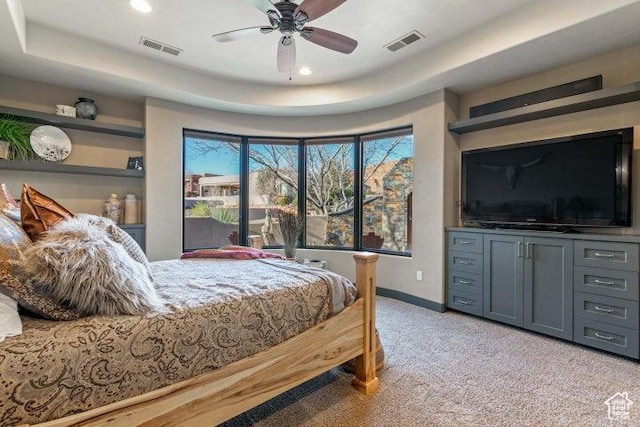 3052 N Snow Canyon Pkwy Unit 67, St George, UT 84770 - bedroom with baseboards, light carpet, visible vents, and a raised ceiling
