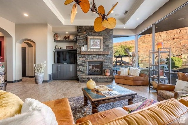 3052 N Snow Canyon Pkwy Unit 67, St George, UT 84770 - living room with ceiling fan, visible vents, arched walkways, and a raised ceiling