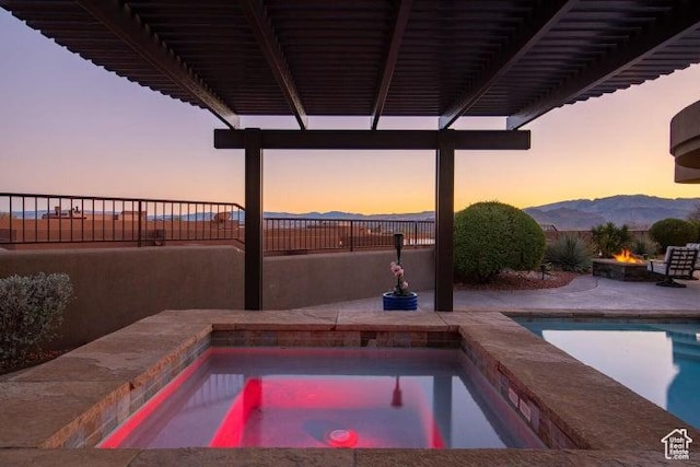 3052 N Snow Canyon Pkwy Unit 67, St George, UT 84770 - view of pool with fence, a patio, an outdoor fire pit, and an in ground hot tub