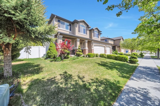 view of front of house featuring a front lawn, fence, a porch, a garage, and stucco siding