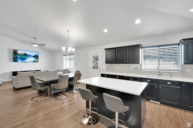 614 S Woodruff Way, Grantsville, UT 84029 - kitchen with light countertops, lofted ceiling, a healthy amount of sunlight, and a sink