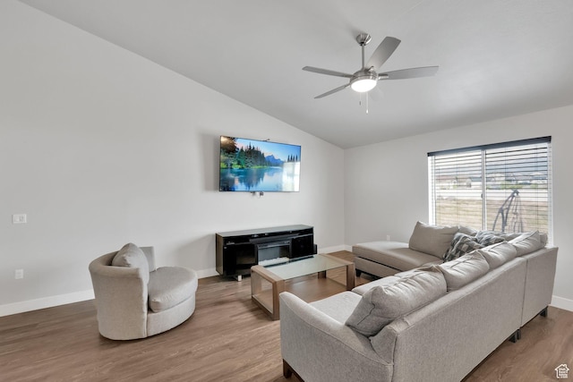 614 S Woodruff Way, Grantsville, UT 84029 - living area featuring vaulted ceiling, a ceiling fan, baseboards, and wood finished floors