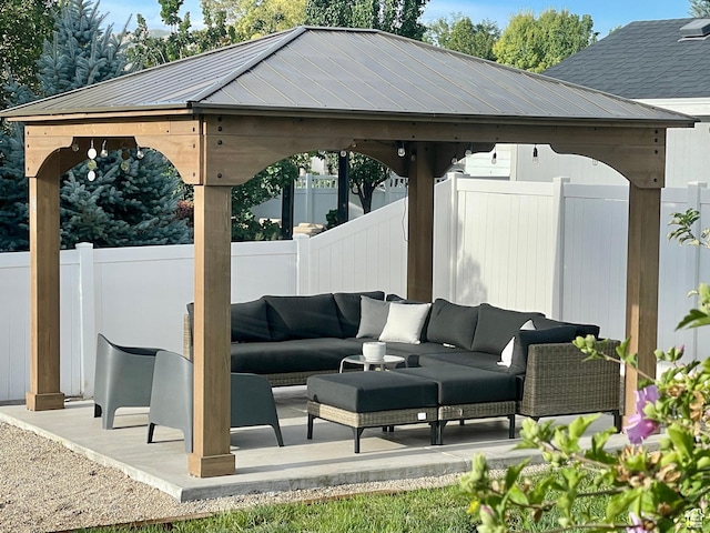 view of patio / terrace with a fenced backyard, outdoor lounge area, and a gazebo