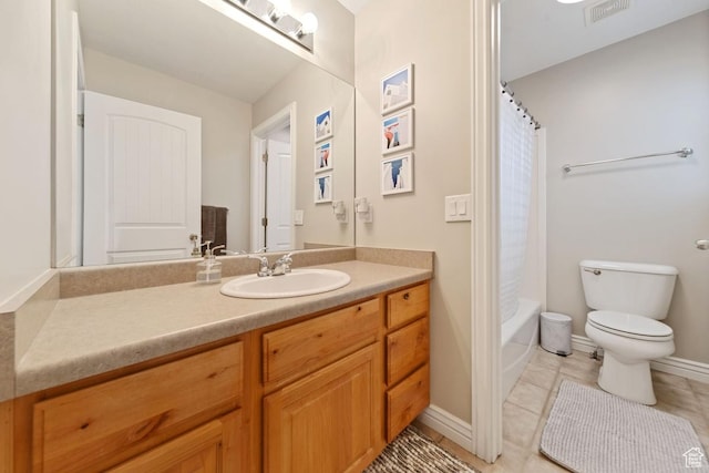 bathroom featuring tile patterned floors, toilet, baseboards, visible vents, and vanity
