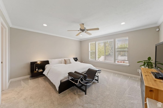 bedroom featuring light carpet, crown molding, and baseboards