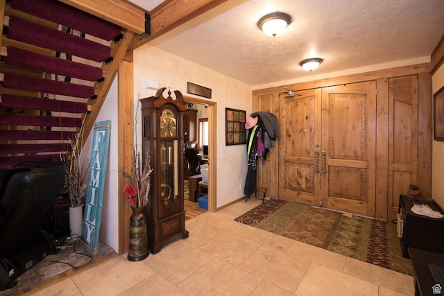 3090 N Rocky Rd E, Kamas, UT 84036 - foyer entrance featuring a textured ceiling and stairs