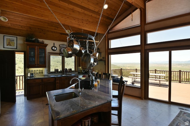 3090 N Rocky Rd E, Kamas, UT 84036 - dining room with tile patterned floors, wooden ceiling, high vaulted ceiling, and a healthy amount of sunlight