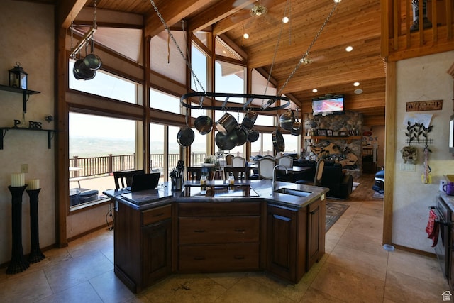 3090 N Rocky Rd E, Kamas, UT 84036 - kitchen with dark countertops, wooden ceiling, high vaulted ceiling, and a sink