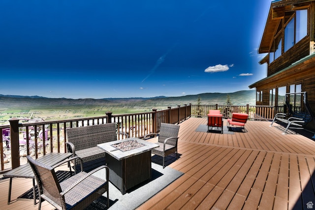 3090 N Rocky Rd E, Kamas, UT 84036 - wooden terrace featuring an outdoor living space with a fire pit and a mountain view