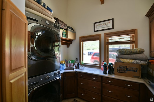 3090 N Rocky Rd E, Kamas, UT 84036 - laundry room featuring cabinet space and stacked washing maching and dryer