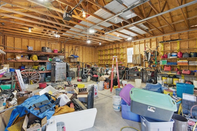 150 S Haulage Rd, Eureka, UT 84628 - garage with a garage door opener and a workshop area