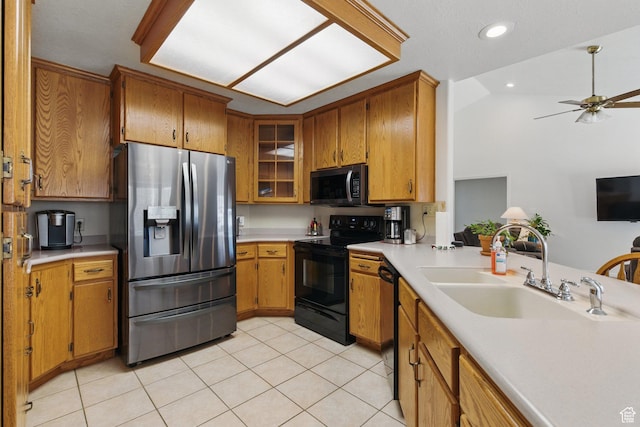 150 S Haulage Rd, Eureka, UT 84628 - kitchen with brown cabinetry, light tile patterned floors, stainless steel appliances, light countertops, and a sink