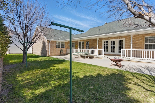 150 S Haulage Rd, Eureka, UT 84628 - back of property featuring a patio area, a yard, french doors, and brick siding