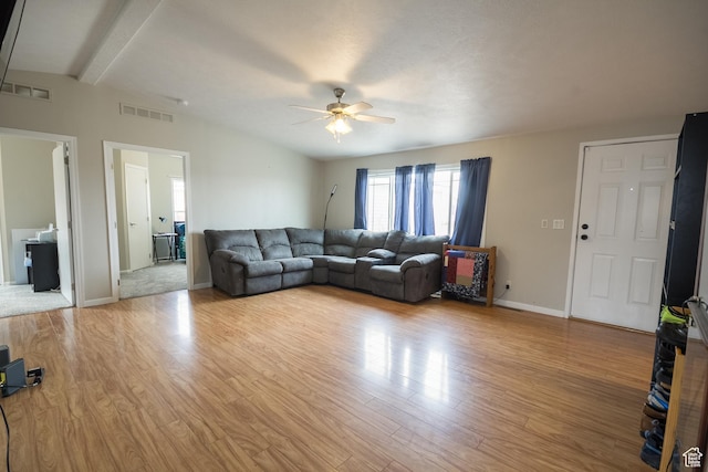 303 W 2000 S, Vernal, UT 84078 - living area with visible vents, light wood-type flooring, a ceiling fan, and vaulted ceiling with beams
