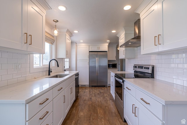 326 E 200 S, Logan, UT 84321 - kitchen with stainless steel appliances, wall chimney range hood, white cabinets, a sink, and dark wood-style floors